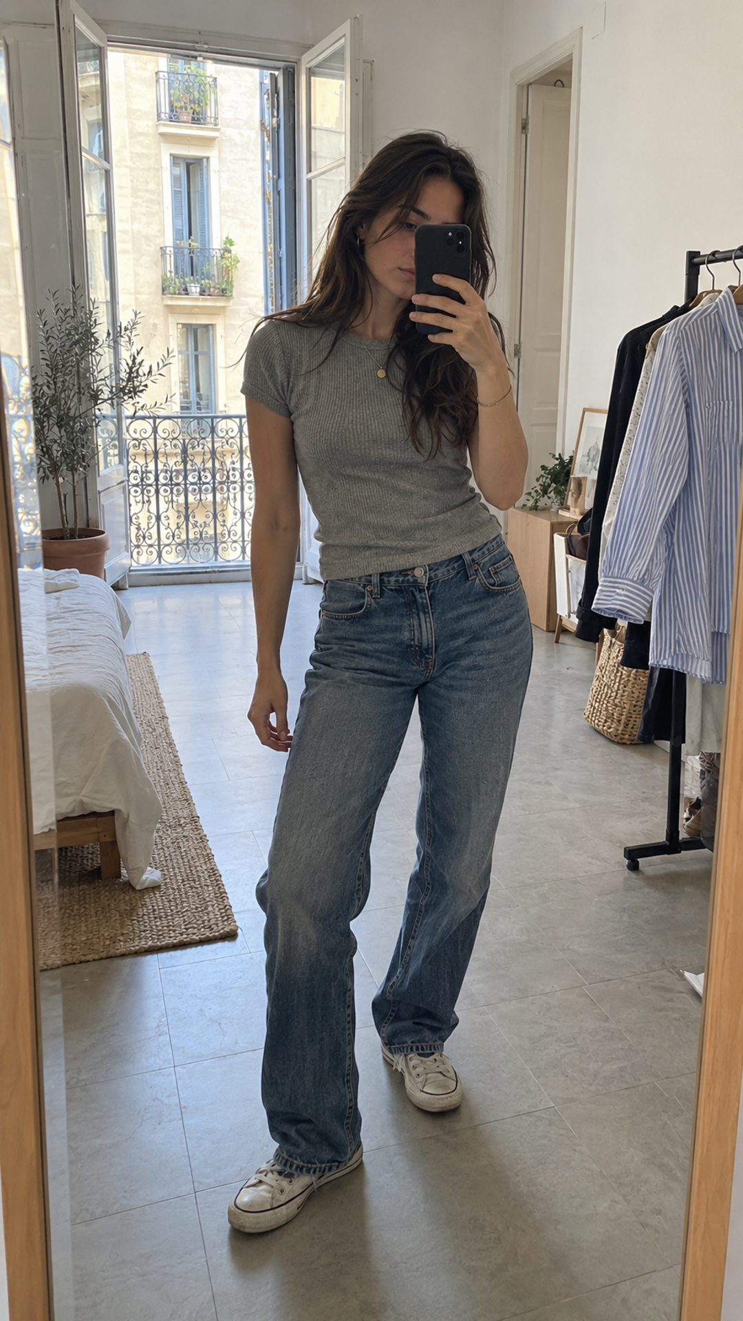 Seller taking a candid mirror outfit photo